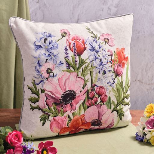 A colourful flower cushion which helps bring nature indoors.