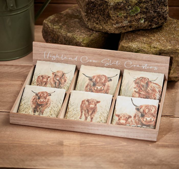 Highland cow coasters with Scottish design placed on a table, adding rustic charm to home decor. 