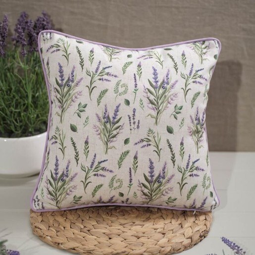 Lavender Cushions featuring a delicate purple floral design, styled on a woven mat beside a lavender plant.